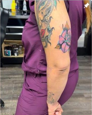 Color floral mandala upper arm tattoo by Aaron Raines