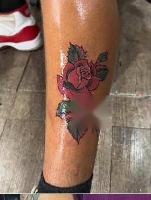 Color traditional red rose tattoo on leg by Aaron Raines