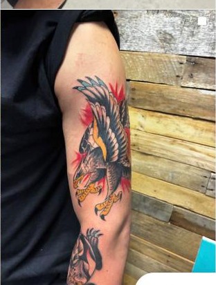 Color traditional eagle and snake tattoo on upper arm by Aaron Raines