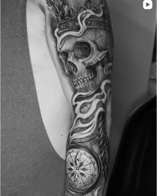 Black and grey crowned skull and compass sleeve tattoo by Thelmo