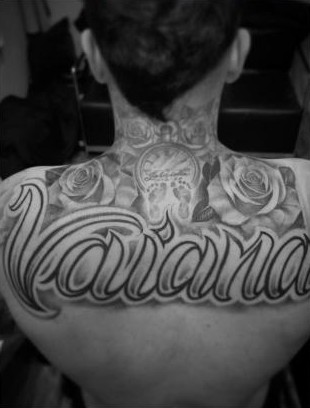 Script name lettering with roses across the upper back, by Thelmo
