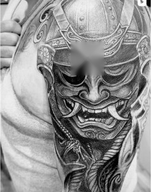Black and grey samurai oni mask tattoo by Thelmo