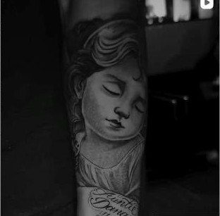 Black and grey religious portrait tattoo with script lettering, by Thelmo