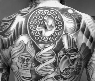 Black and grey back piece with DNA helix, flower of life, and carved masks, by Thelmo