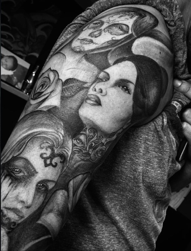 Chicano-style portrait sleeve with roses and sugar skull