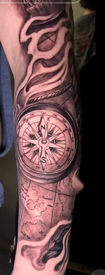 Black and grey nautical sleeve with compass, rope, and map